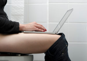 I was a workaholic (still am, actually), but I've never actually had my laptop on the toilet.